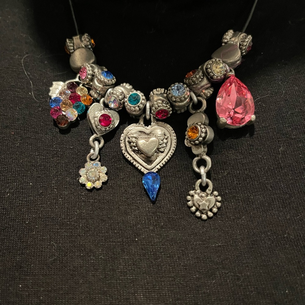 Equisite Otazu brand gorgeous necklace.  Gems strung on a black cord